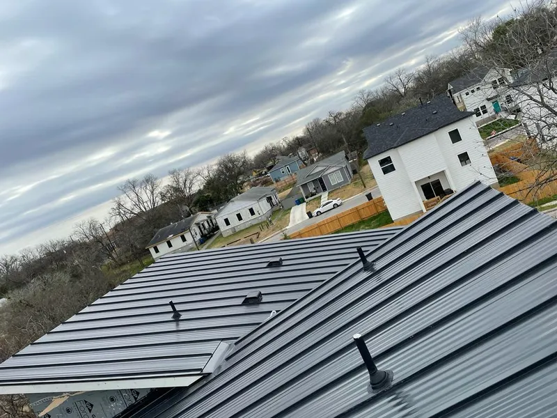 Standing seam metal roof panels with vents for Skylight Repair in Island Park